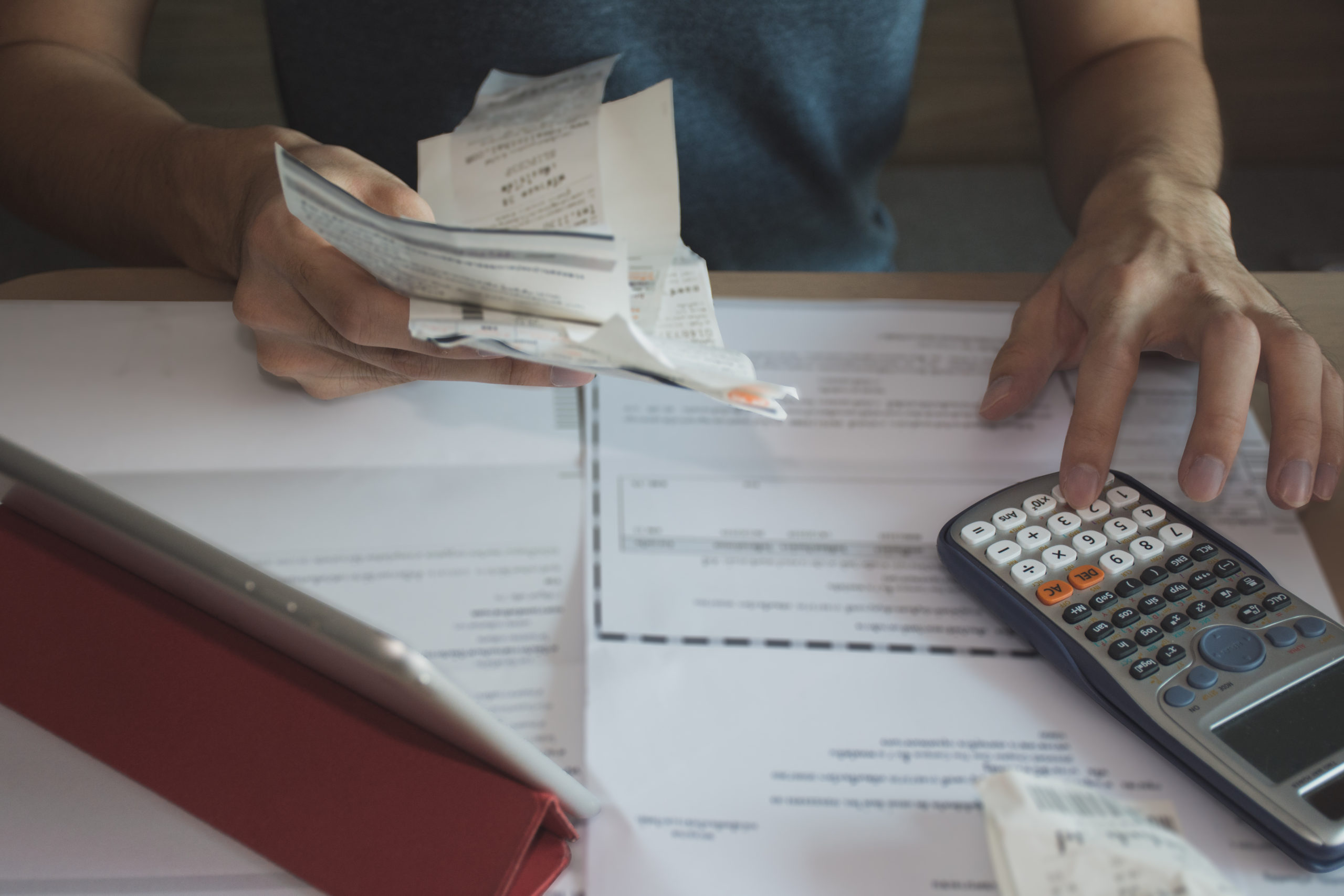 man using calculator for calculate expenses accounts tax accountant using calculator