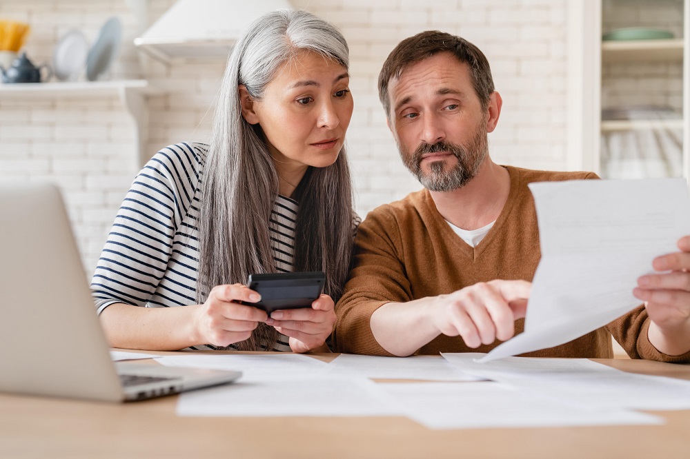 couple looking at delinquent tax notice