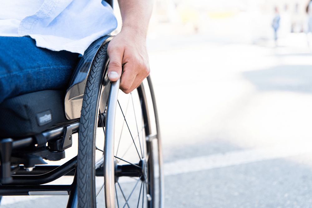 man in wheelchair with tax debt