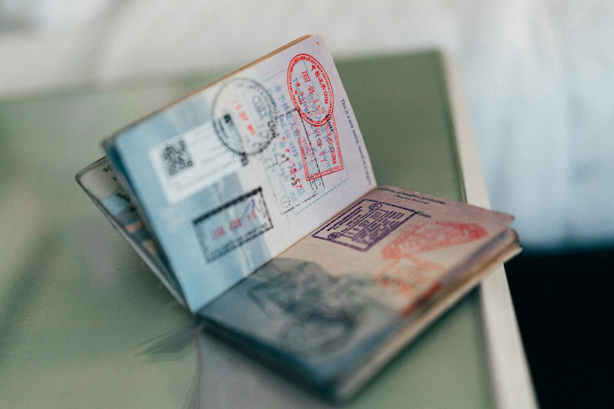 Open passport with travel stamps