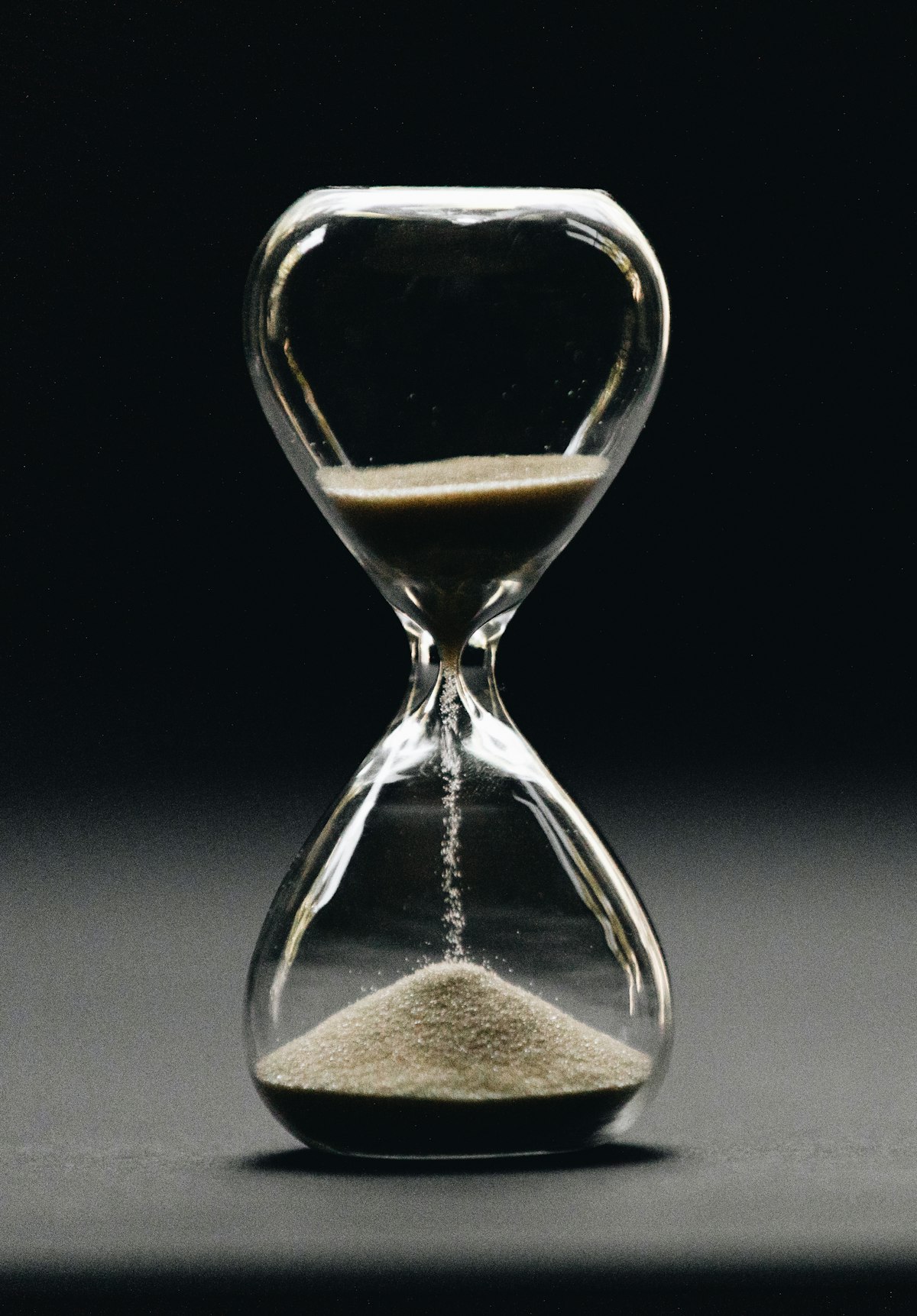 Hourglass marking time on a desk